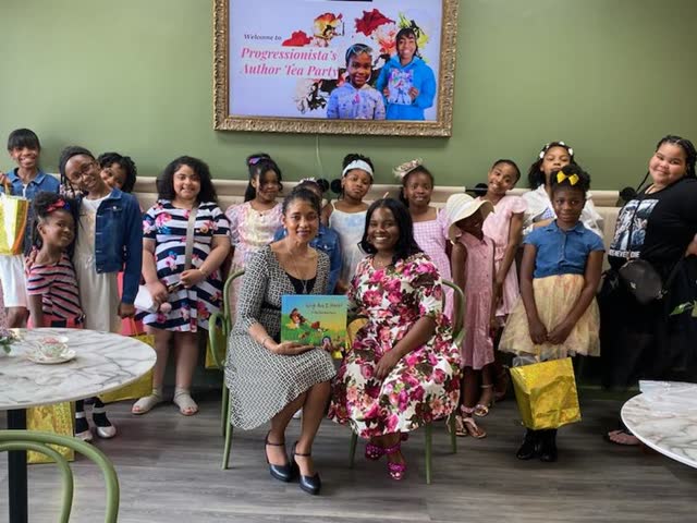 Naomi V. Dunsen-White with guests at a Progressionista author tea party